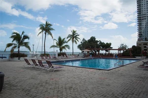 an ocean view with outdoor seating
