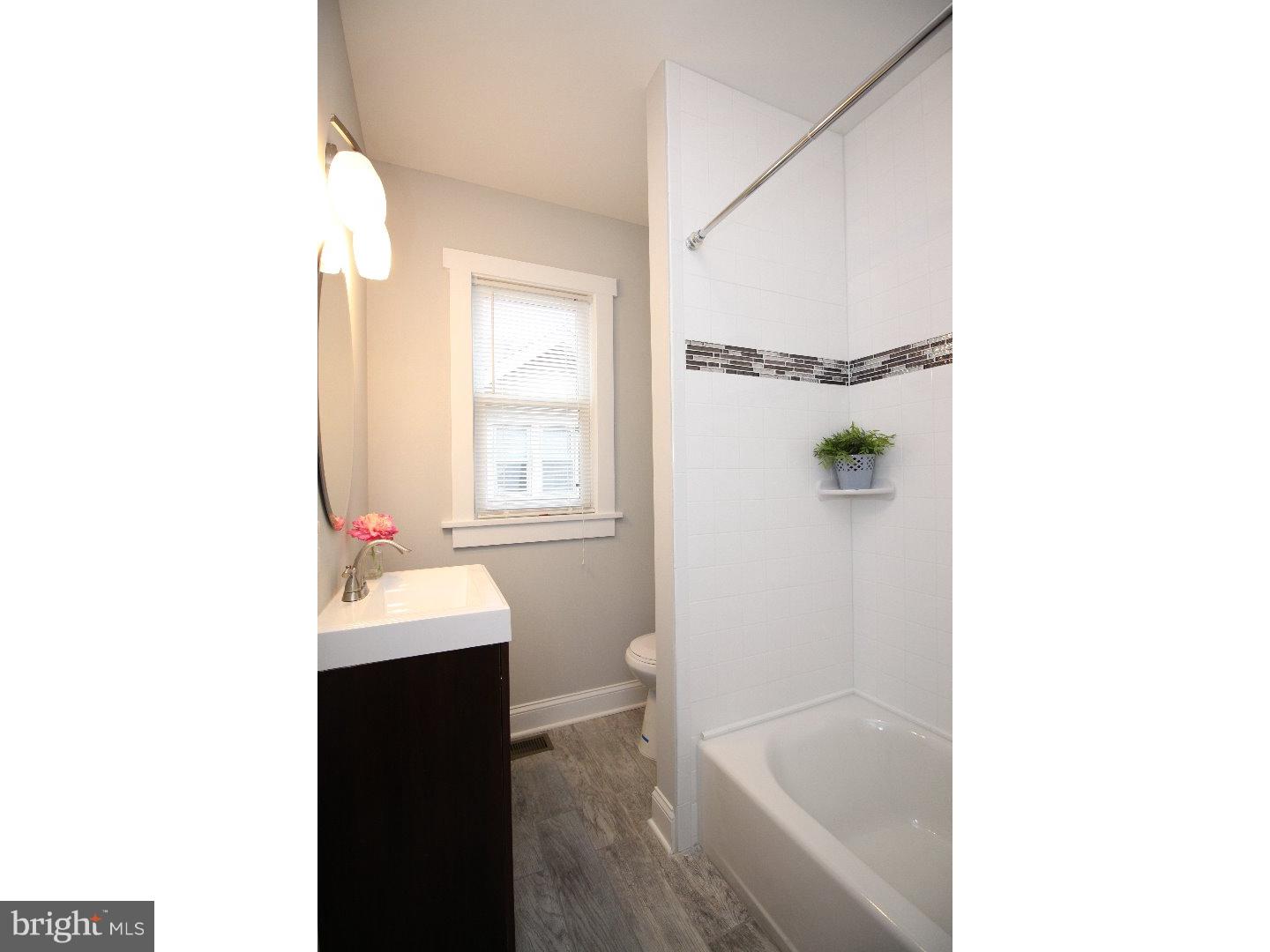 100 Princeton Road Audubon, NJ 08106 - Photo 11 of 20 a bathroom with a sink and a bathtub