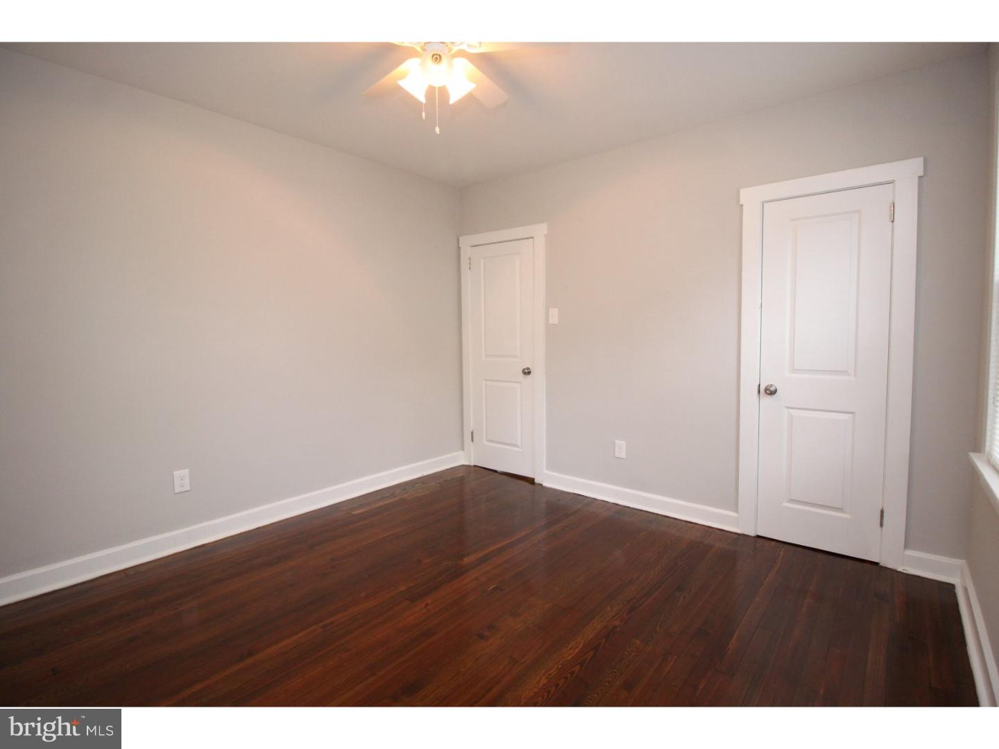 100 Princeton Road Audubon, NJ 08106 - Photo 14 of 20 an empty room with wooden floor and windows
