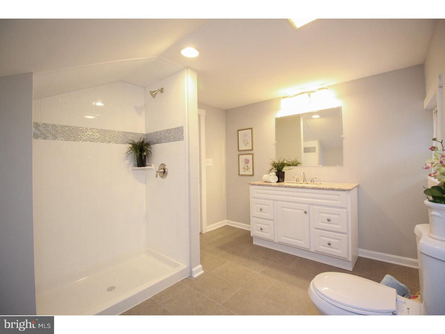 100 Princeton Road Audubon, NJ 08106 - Photo 17 of 20 a bathroom with a sink a toilet and shower