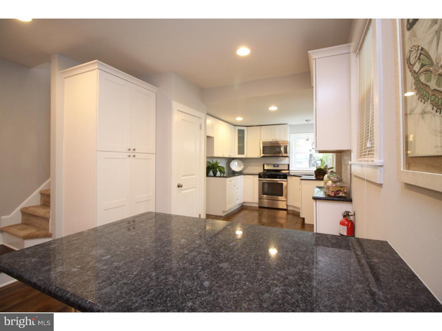 100 Princeton Road Audubon, NJ 08106 - Photo 7 of 20 a kitchen view with stainless steel appliances wooden floor and living room view