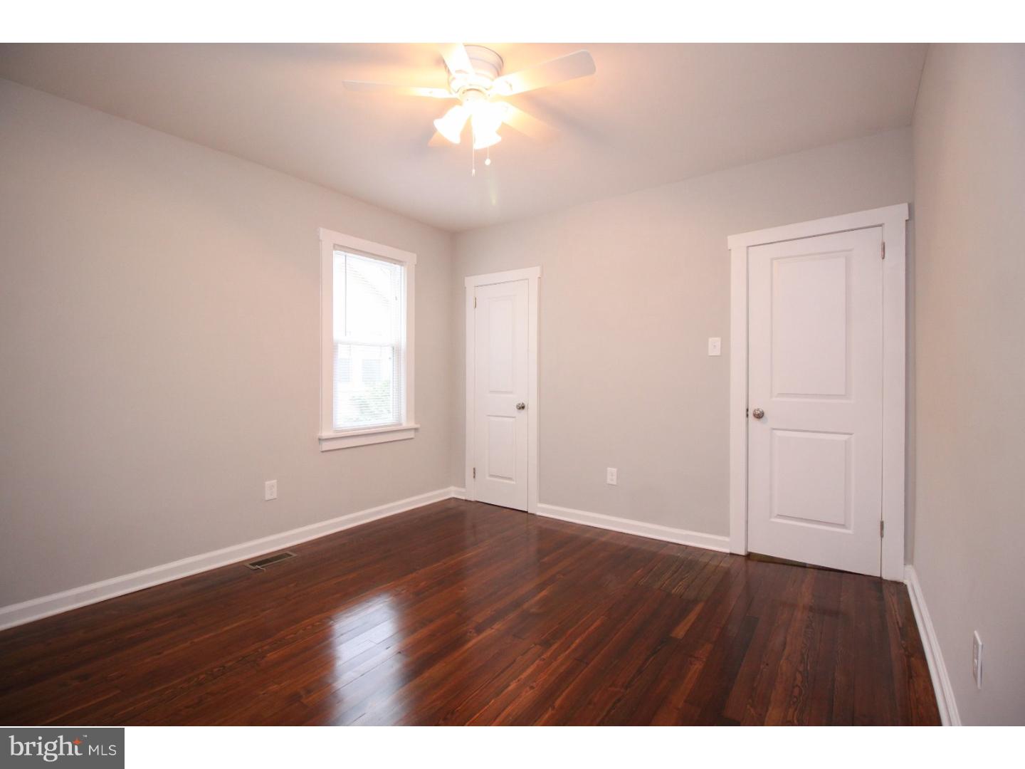 100 Princeton Road Audubon, NJ 08106 - Photo 9 of 20 a view of an empty room with window and wooden floor