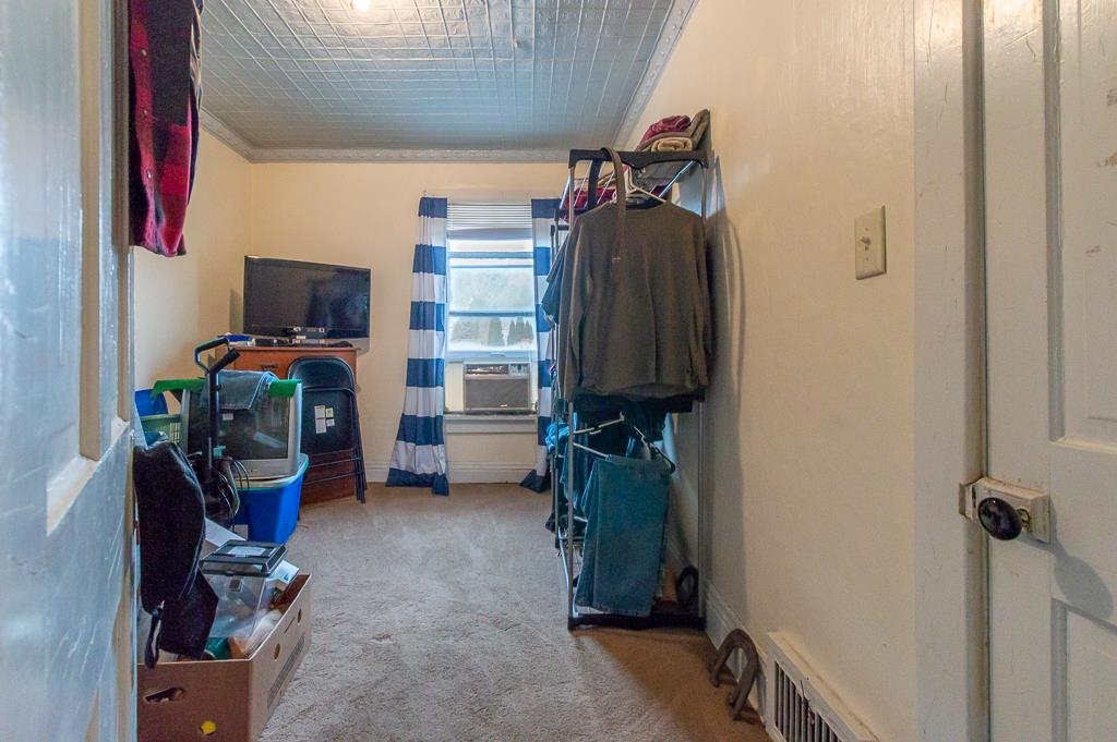 318 6th Avenue Rochelle, IL 61068 - Photo 6 of 11 a view of walk in closet with clothes