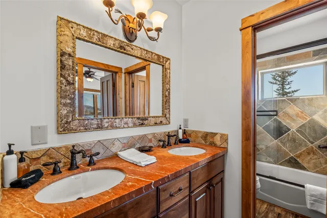 a bedroom with a bed and a large window with outer view