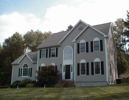 1 Ridge Road Framingham, MA 01701 - Photo 1 of 1 a front view of a house with a garden