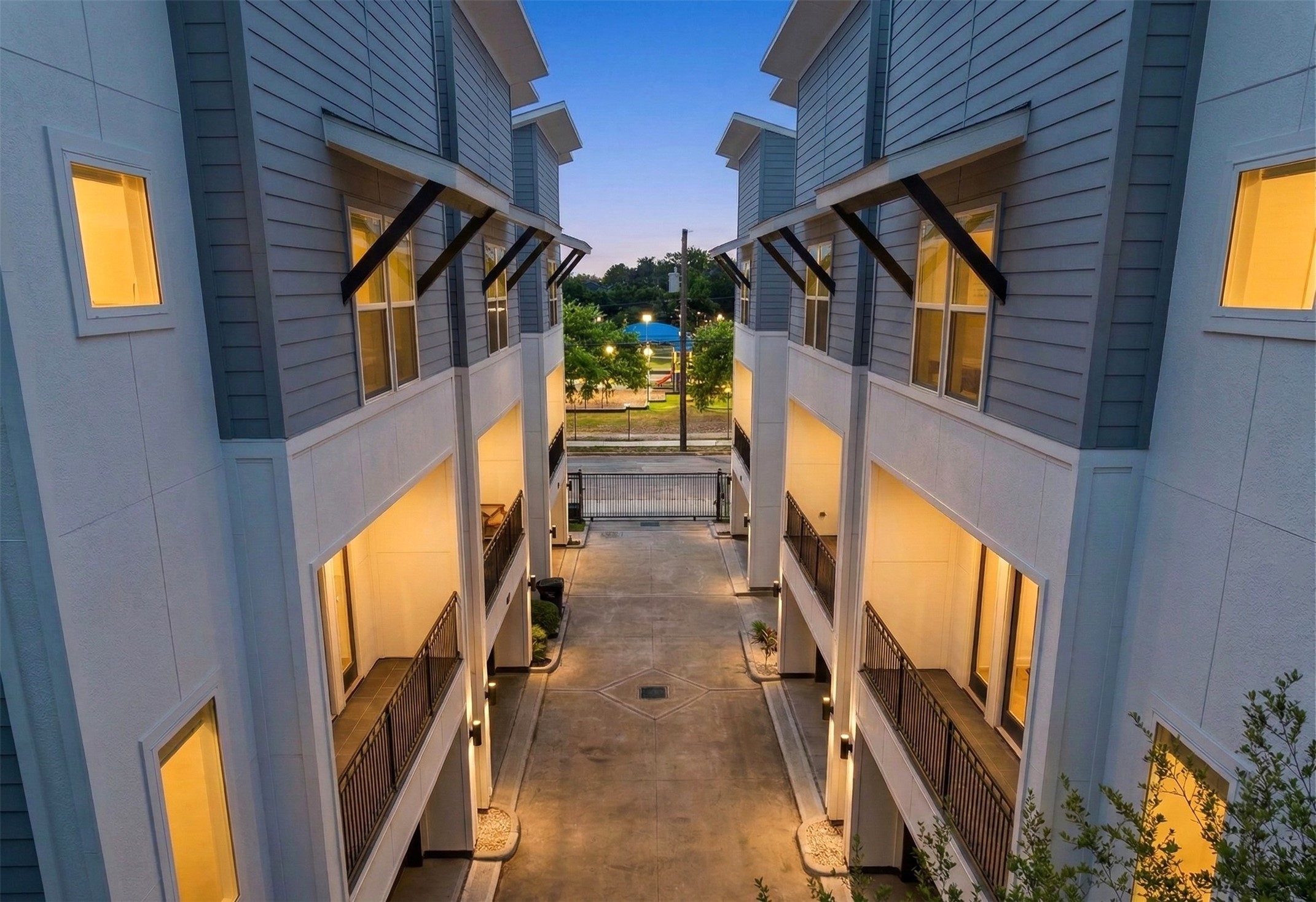 903 Quitman Street, Unit B Houston, TX 77009 - Photo 1 of 23 Striking modern elevation with clean architectural lines, mixed exterior finishes, and a gated entry for added privacy. Home will be a middle unit. *Enchanced with AI