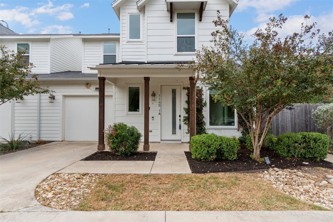 1145 Shady Lane, Unit 1A Austin, TX 78721 - Photo 1 of 25 Modern East Austin home with clean lines, lush landscaping, and private garage plus multiple parking spaces