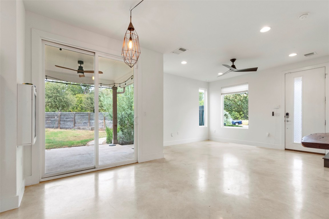 1145 Shady Lane, Unit 1A Austin, TX 78721 - Photo 2 of 25 Bright open living space with polished concrete floors and views of the backyard.