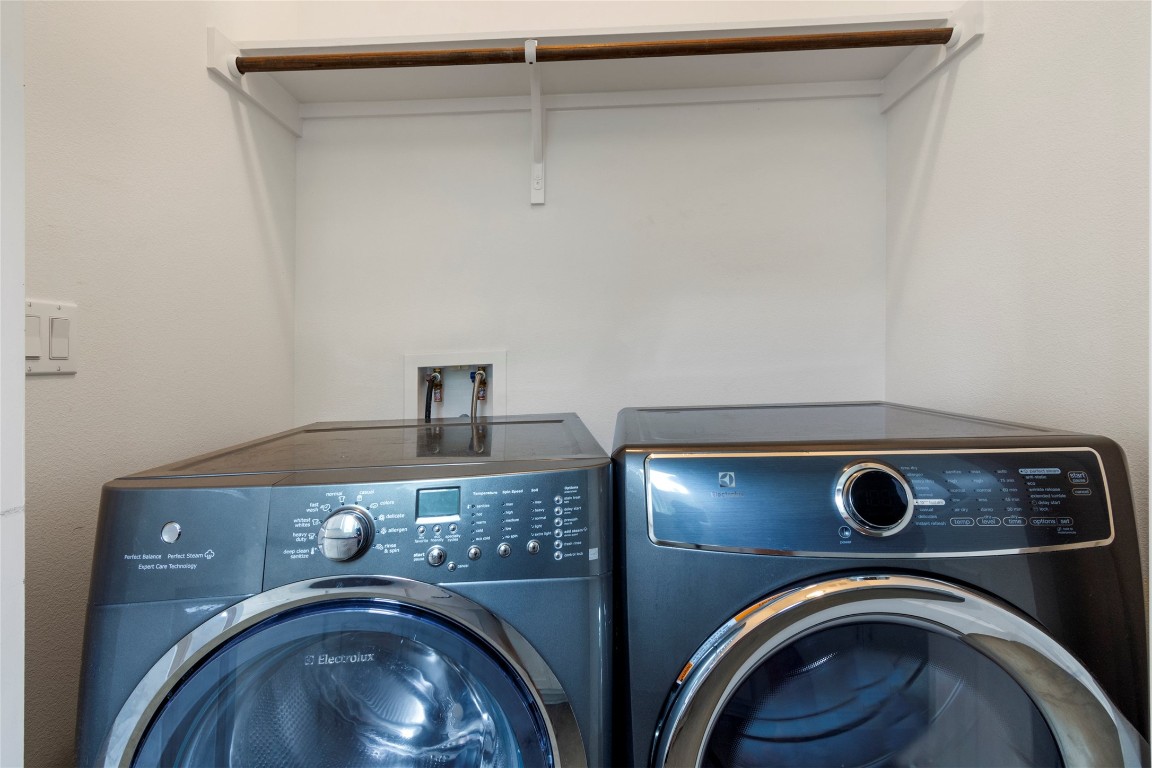1145 Shady Lane, Unit 1A Austin, TX 78721 - Photo 24 of 25 Laundry Area – Convenient main level laundry with full-size washer and dryer.
