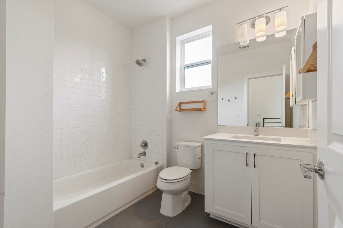 1145 Shady Lane, Unit 1A Austin, TX 78721 - Photo 10 of 25 Guest Bathroom – Fresh, modern full bath with subway tile and updated fixtures.
