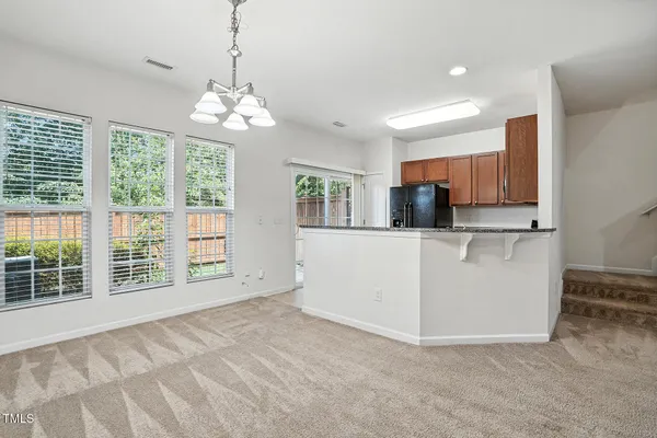 a view of a kitchen with a sink cabinet and a living room