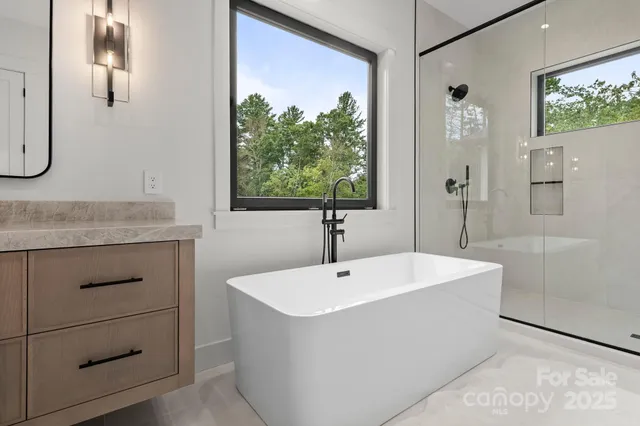 a bathroom with a bathtub and a sink