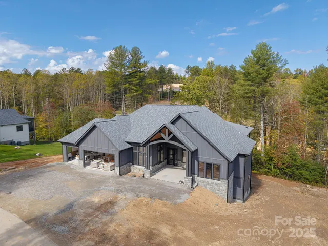 a view of a terrace with a garden and trees