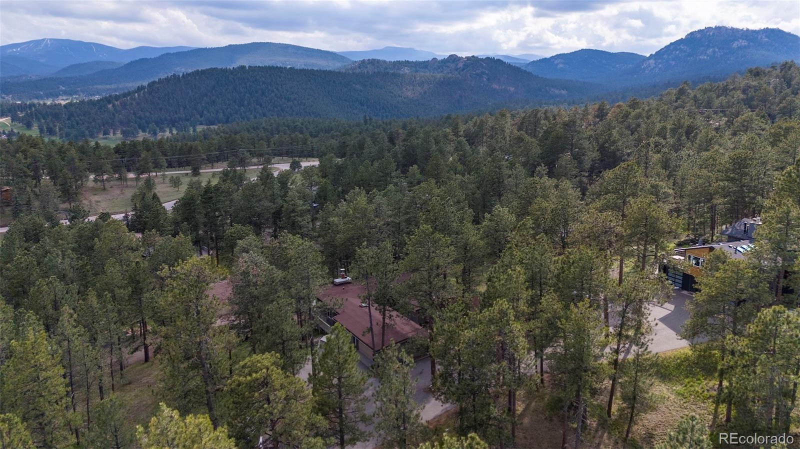 28877 Cedar Circle Evergreen, CO 80439 - Photo 29 of 30 a view of a town with mountains in the background