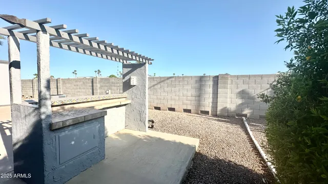 a view of a terrace with wooden floor and a potted plant