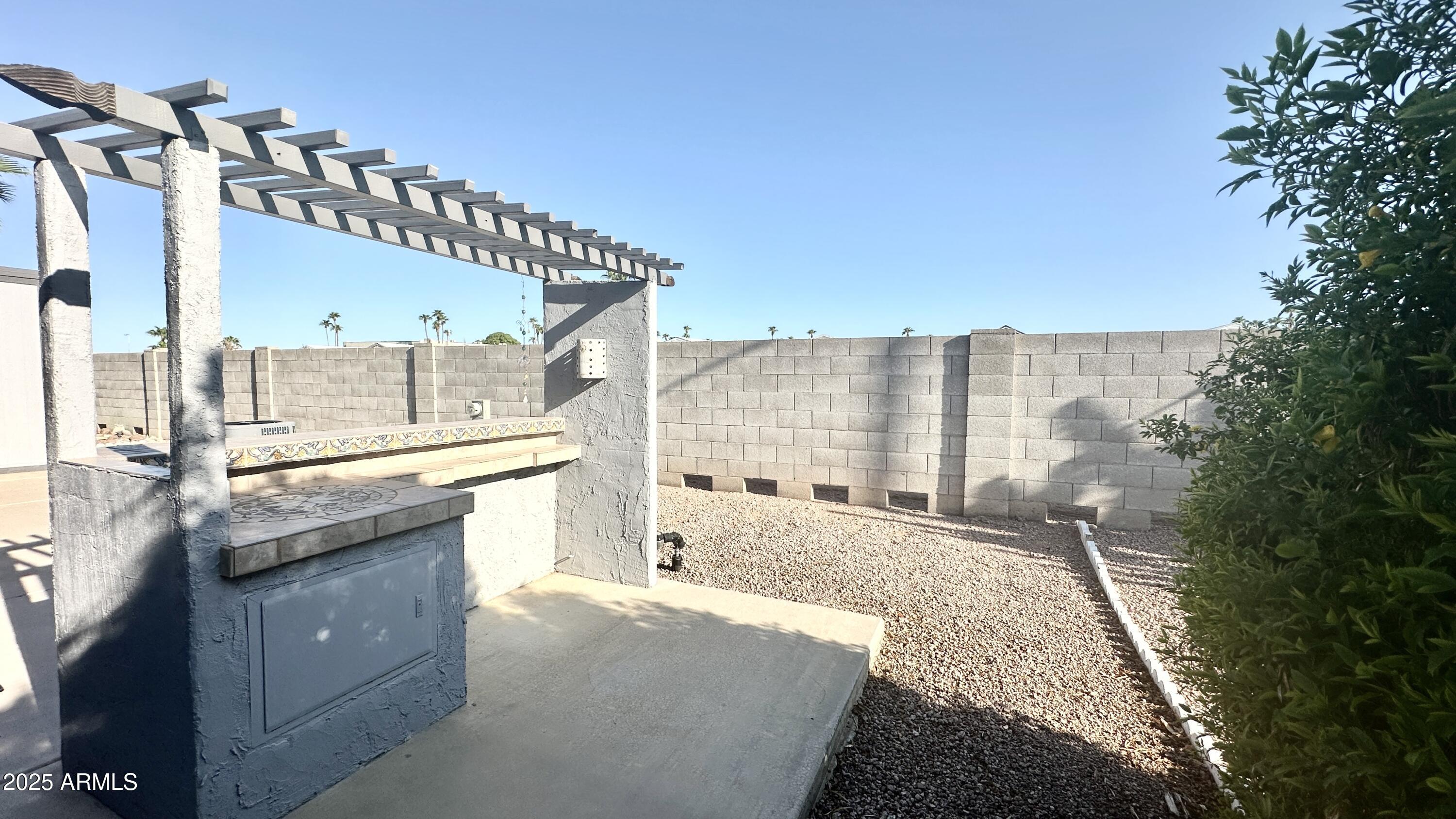 834 South Meridian Road, Unit 76 Apache Junction, AZ 85120 - Photo 11 of 50 a spacious bathroom with a granite countertop sink a large mirror and a bathtub