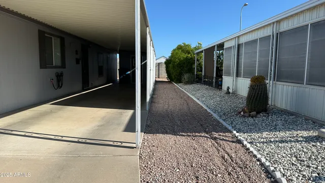 a view of a balcony with furniture and a potted plant