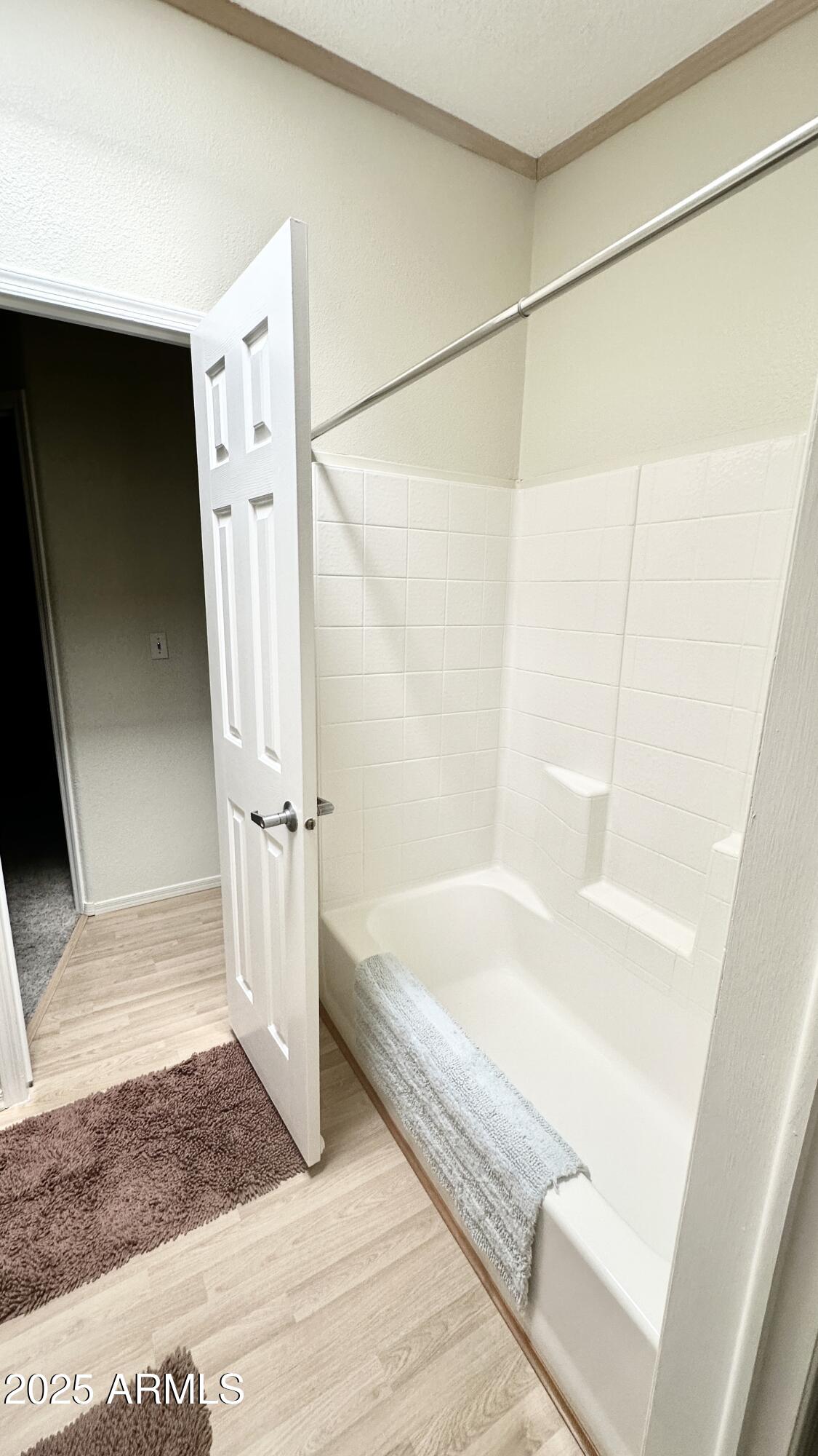 834 South Meridian Road, Unit 76 Apache Junction, AZ 85120 - Photo 21 of 50 a bathroom with a bathtub and a shower