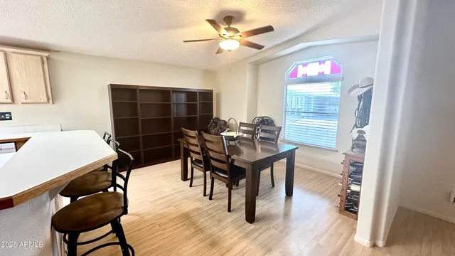 a view of a dining room with furniture and wooden floor