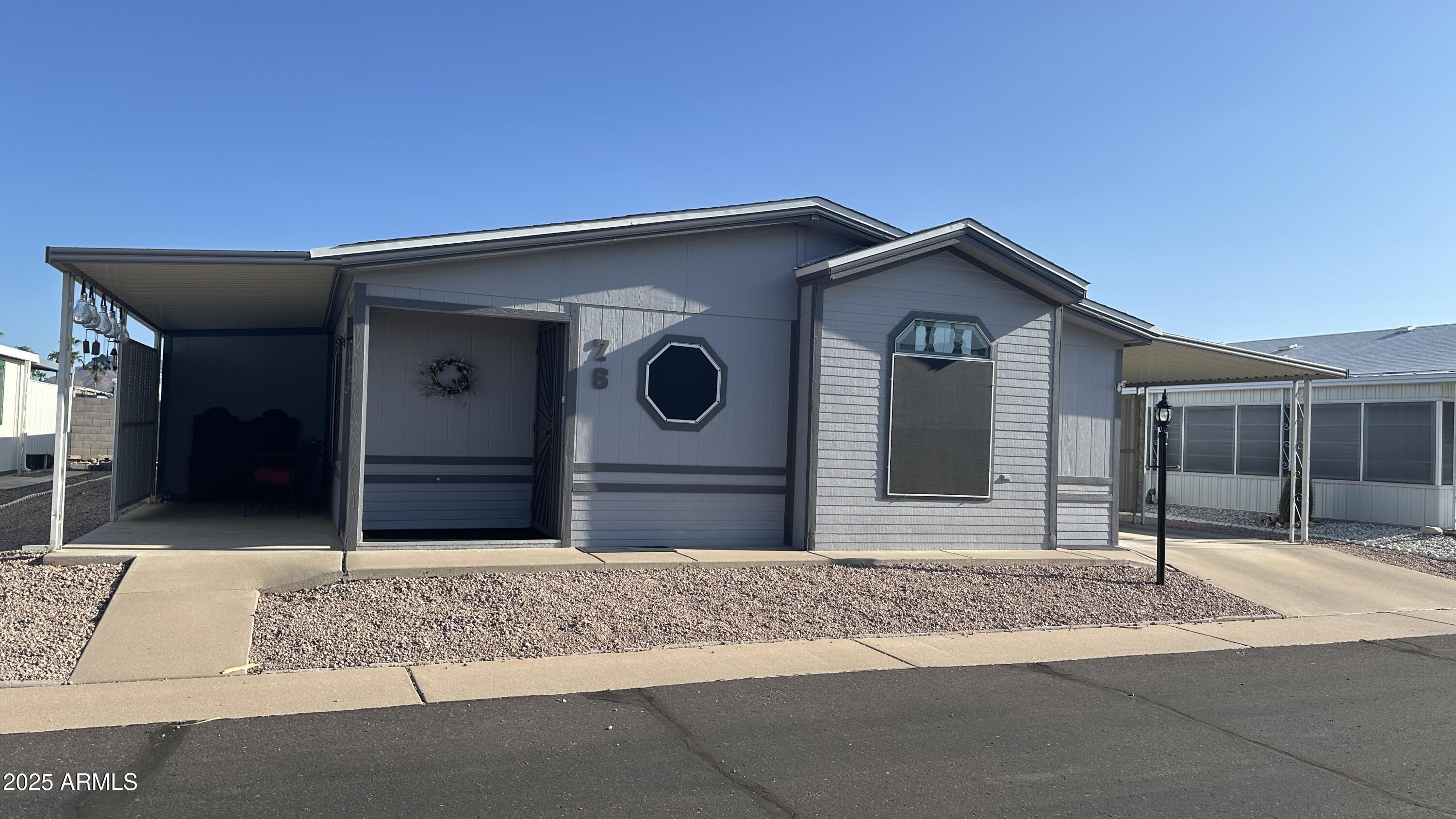834 South Meridian Road, Unit 76 Apache Junction, AZ 85120 - Photo 4 of 50 a house with a outdoor space