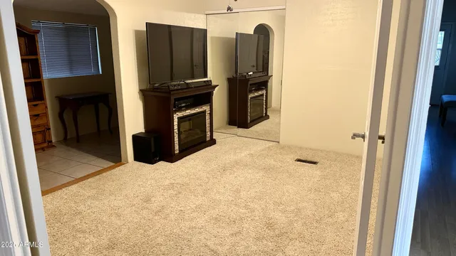 a room with gym equipment and windows