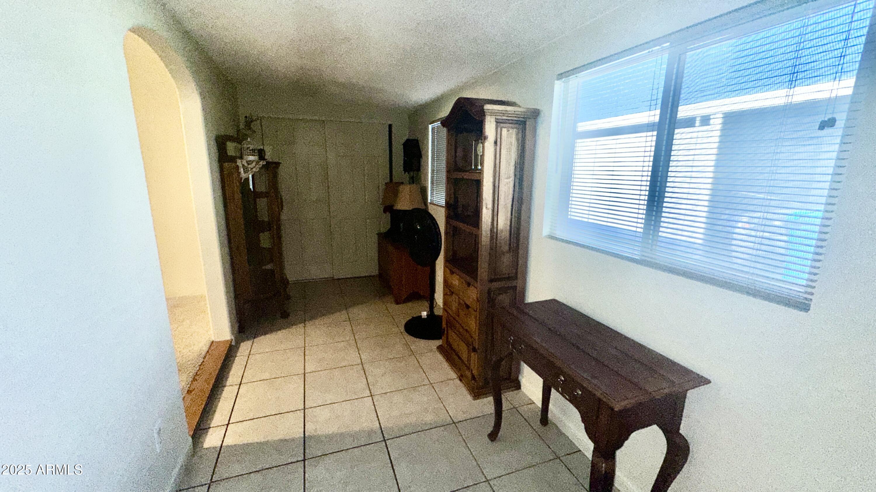 834 South Meridian Road, Unit 76 Apache Junction, AZ 85120 - Photo 44 of 50 a room with gym equipment and windows