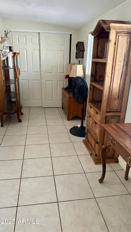a view of livingroom with hardwood floor and ceiling fan