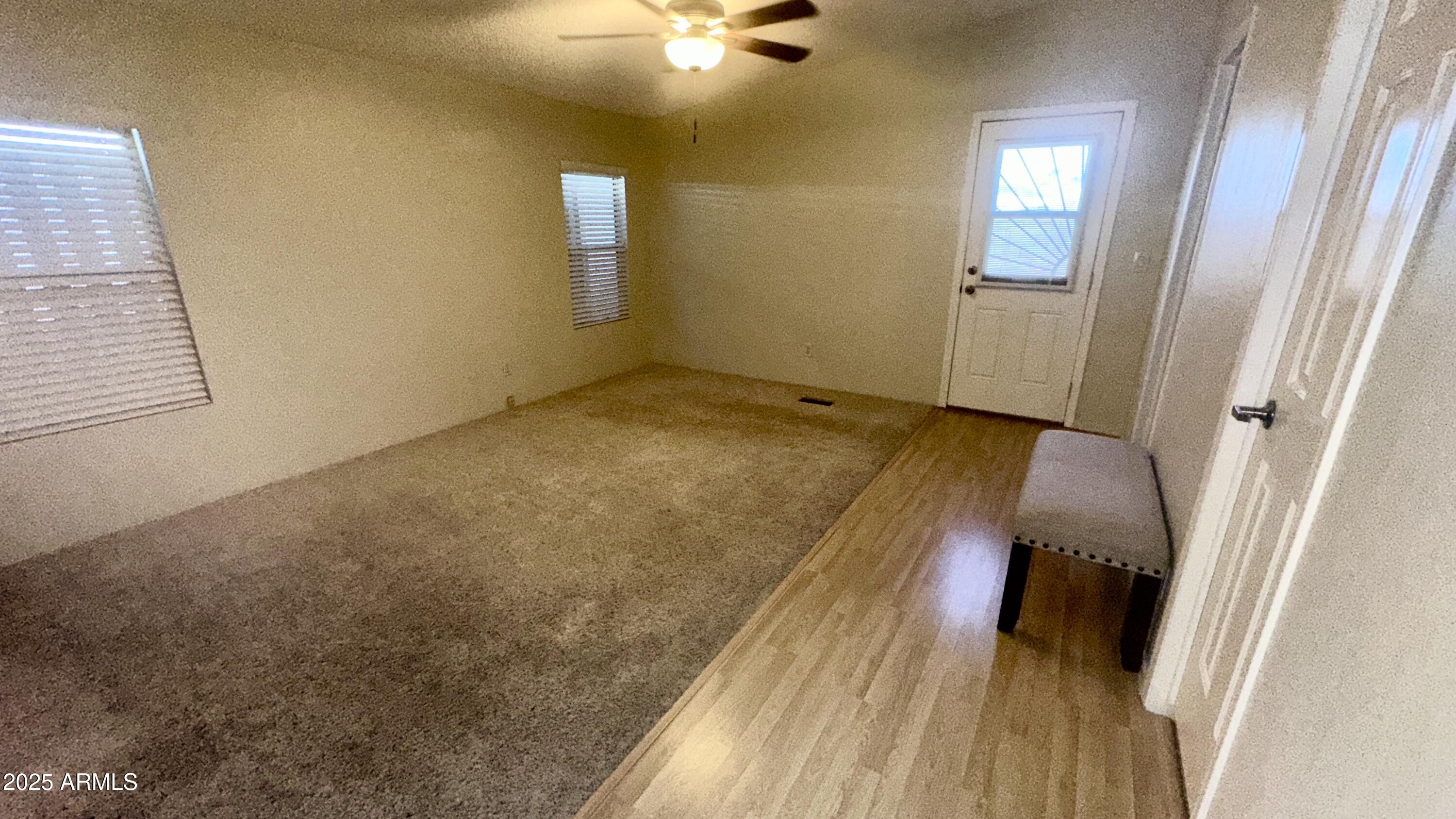 834 South Meridian Road, Unit 76 Apache Junction, AZ 85120 - Photo 46 of 50 a view of a room with wooden floor and staircase