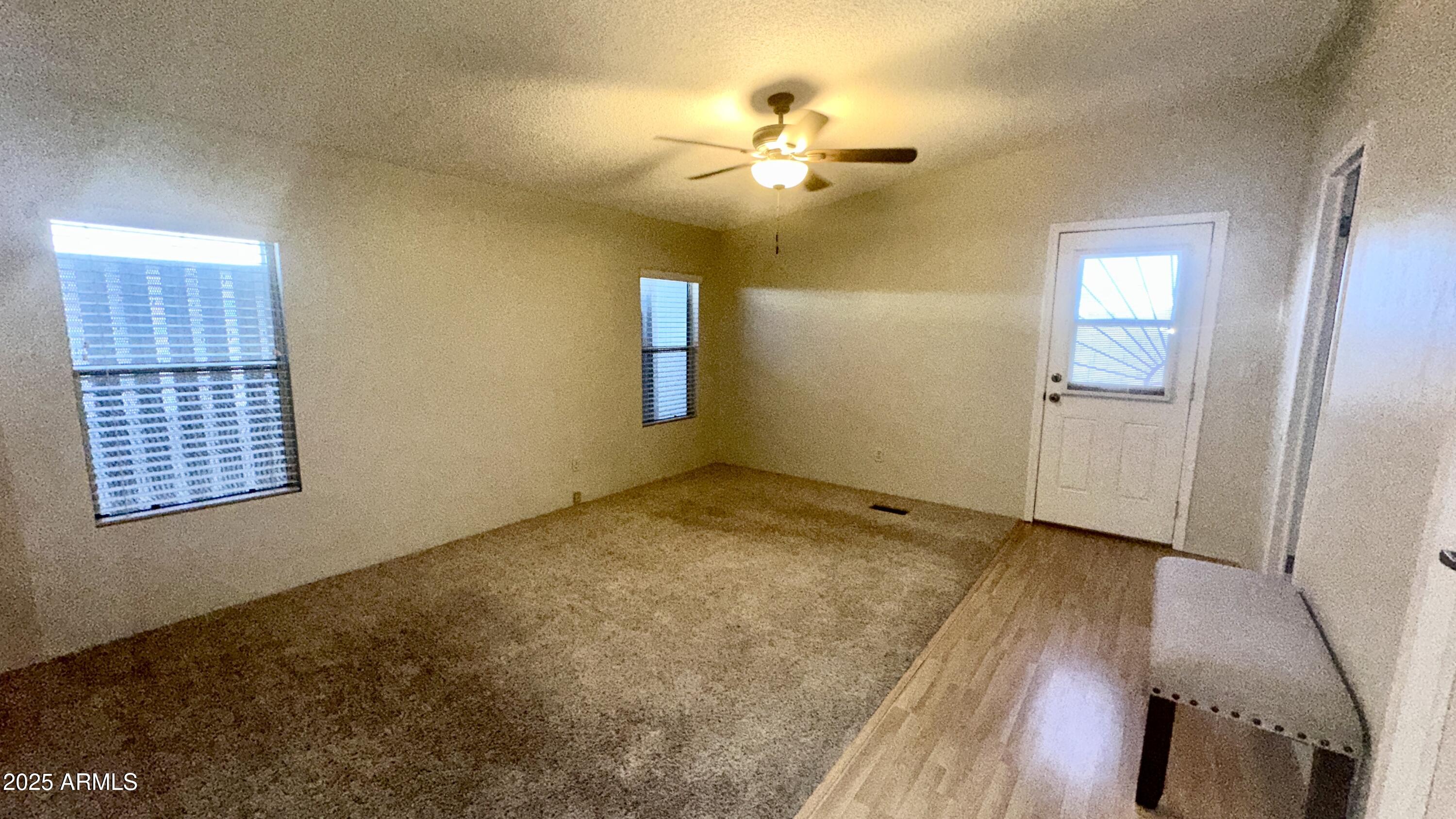 834 South Meridian Road, Unit 76 Apache Junction, AZ 85120 - Photo 47 of 50 a view of livingroom with hardwood floor and ceiling fan