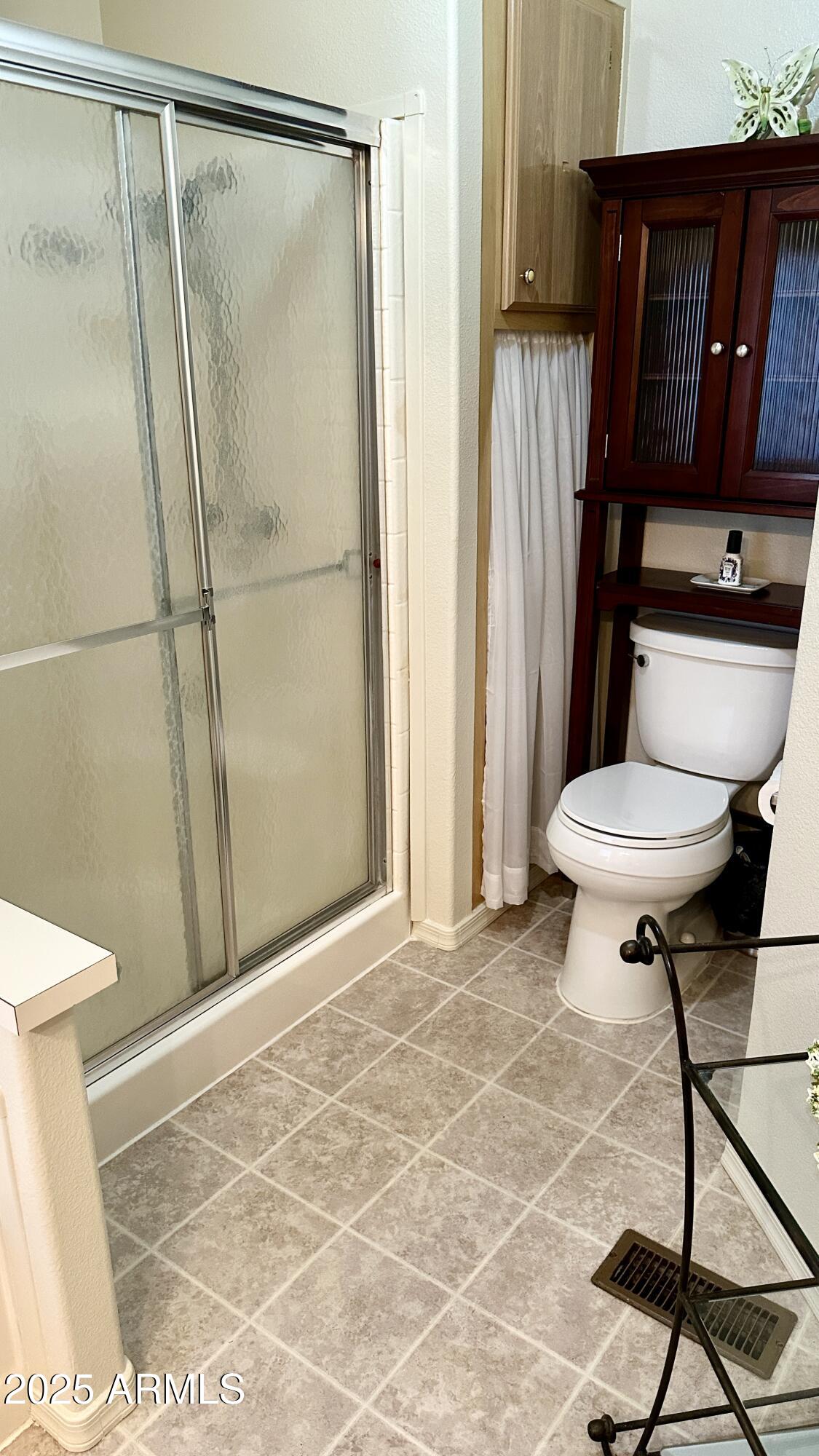 834 South Meridian Road, Unit 76 Apache Junction, AZ 85120 - Photo 49 of 50 a bathroom with a shower and a toilet