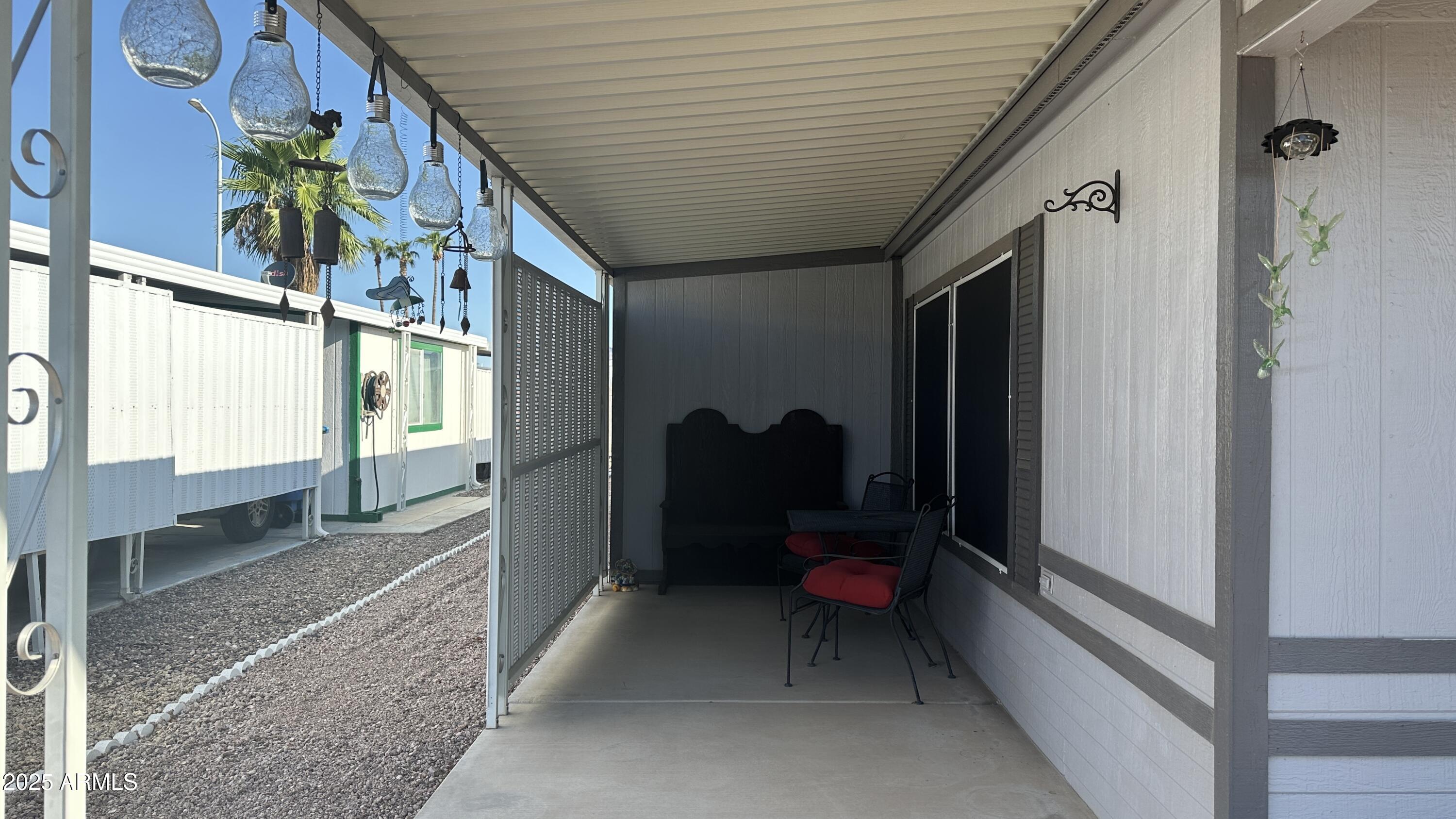 834 South Meridian Road, Unit 76 Apache Junction, AZ 85120 - Photo 6 of 50 a view of a house with a backyard