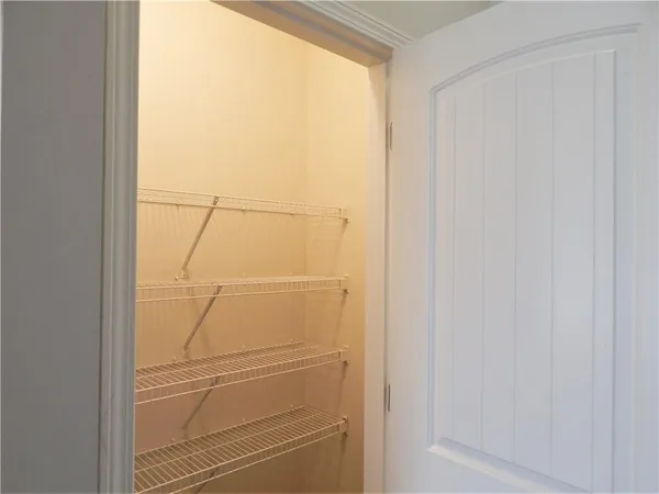 a kitchen that has a sink cabinets stainless steel appliances and wooden floor