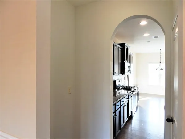 a kitchen with stainless steel appliances granite countertop a stove and a sink