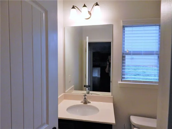 a bathroom with a double vanity sink mirror and double
