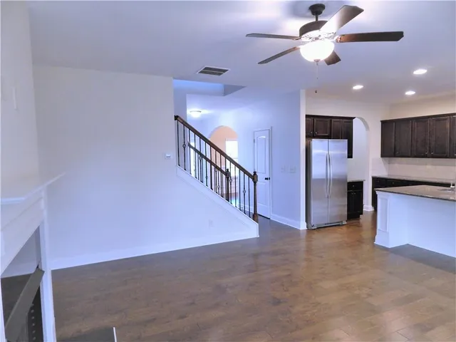 a bathroom with a double vanity sink a mirror and a bathtub