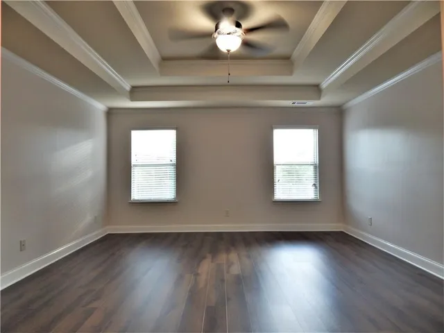 a white toilet sitting next to a bath tub