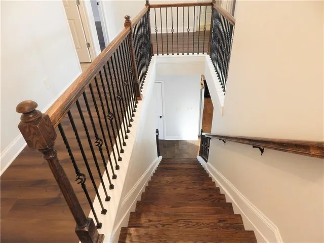 a view of a swimming pool with a lake from a window
