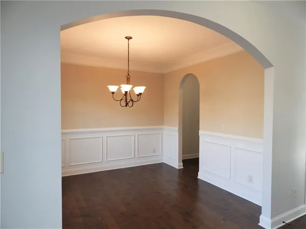 a view of entryway with wooden floor and stairs