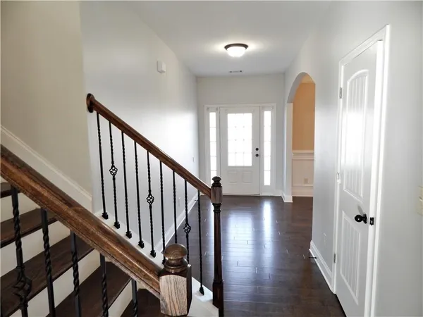 a kitchen with stainless steel appliances granite countertop a sink stove and cabinets