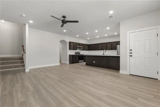 a view of kitchen and kitchen with furniture wooden floor and window