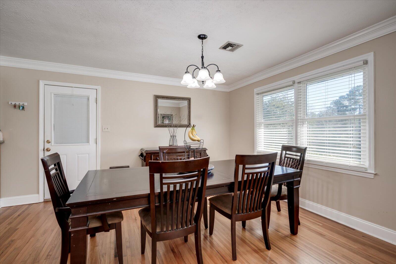 2945 Wagener Road Aiken, SC 29801 - Photo 6 of 47 a view of a dining room with furniture window and wooden floor