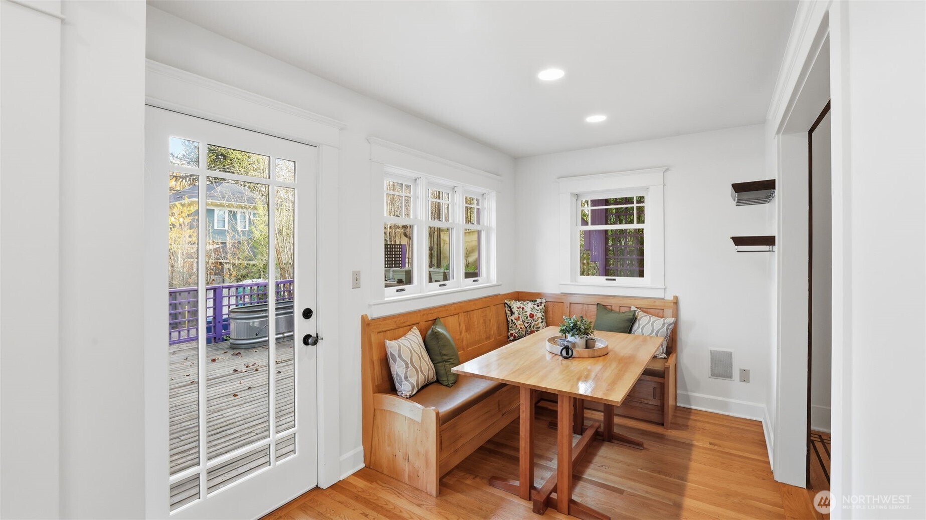 908 15th Avenue East Seattle, WA 98112 - Photo 15 of 37 a view of a dining room with furniture window and wooden floor
