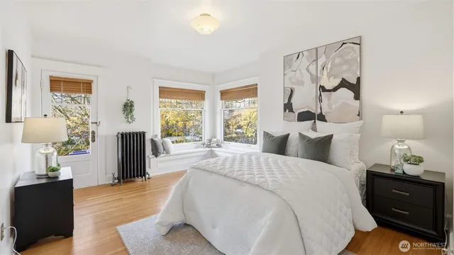 a spacious bedroom with a bed and a window