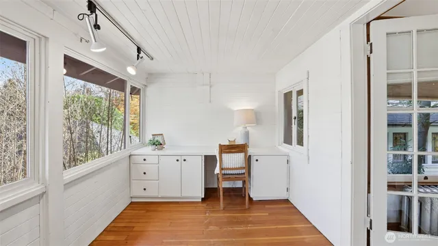a view of a kitchen with furniture and entryway