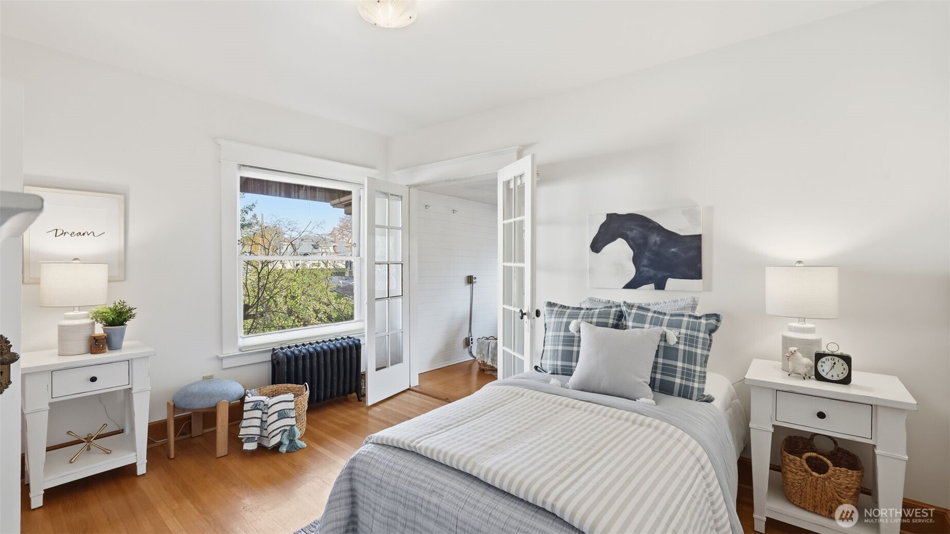 908 15th Avenue East Seattle, WA 98112 - Photo 26 of 37 a bedroom with furniture and a window