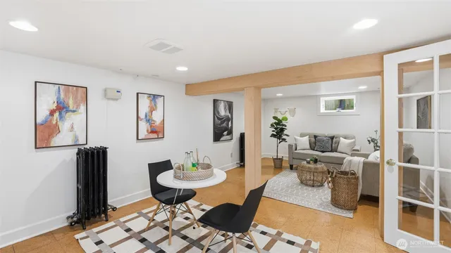 a living room with furniture and wooden floor