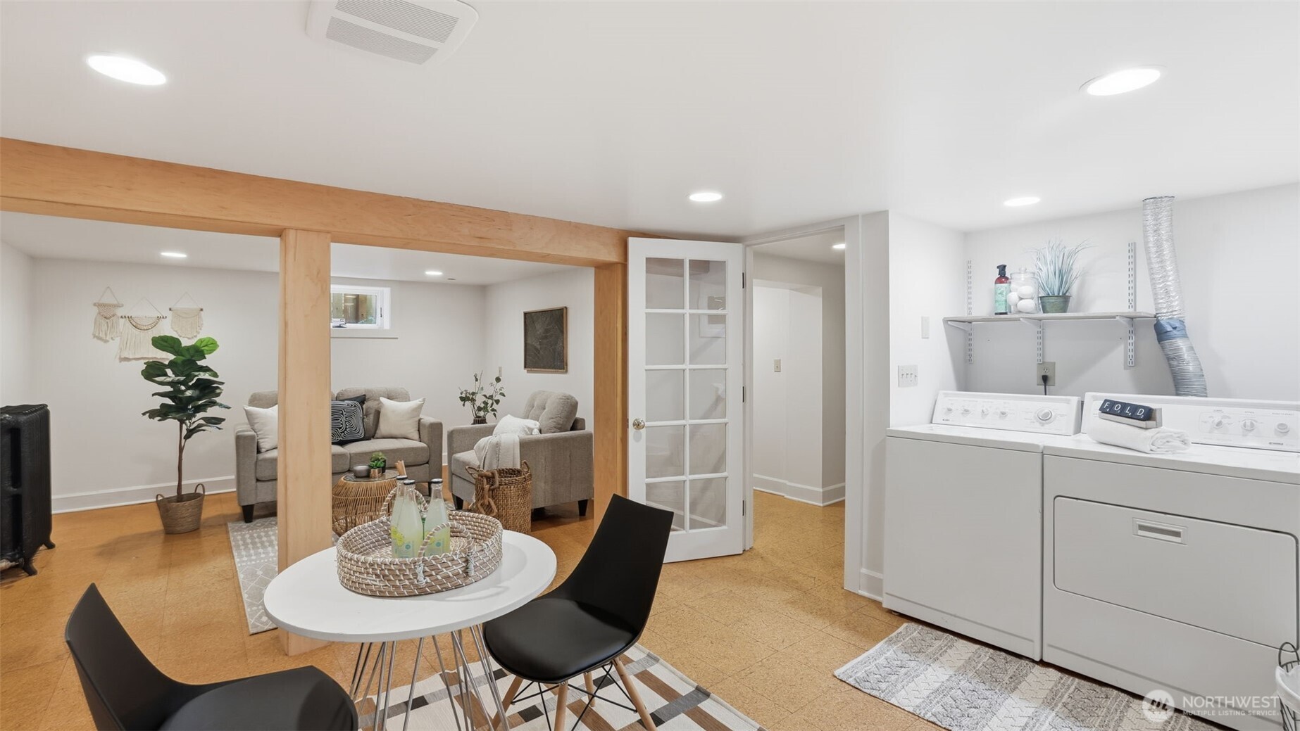 908 15th Avenue East Seattle, WA 98112 - Photo 30 of 37 a view of a dining room with furniture and wooden floor