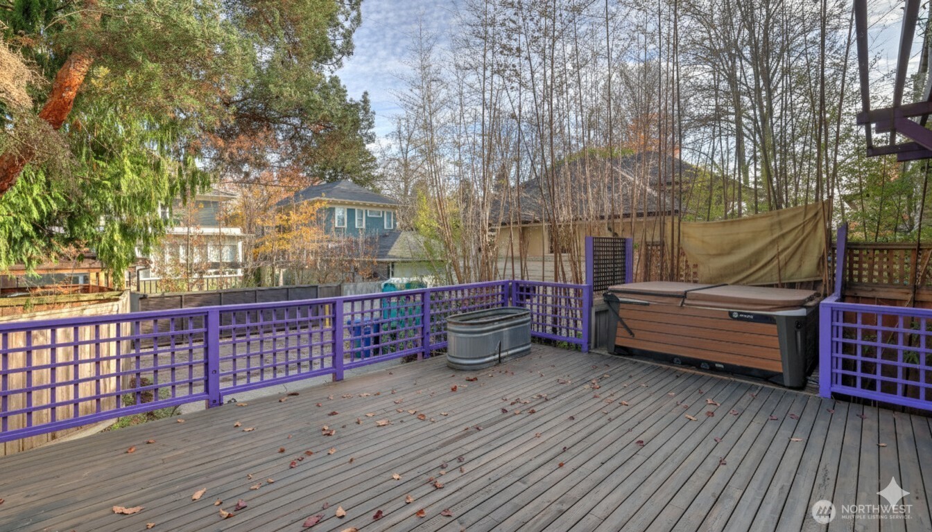 908 15th Avenue East Seattle, WA 98112 - Photo 34 of 37 a view of a roof deck with wooden floor and fence