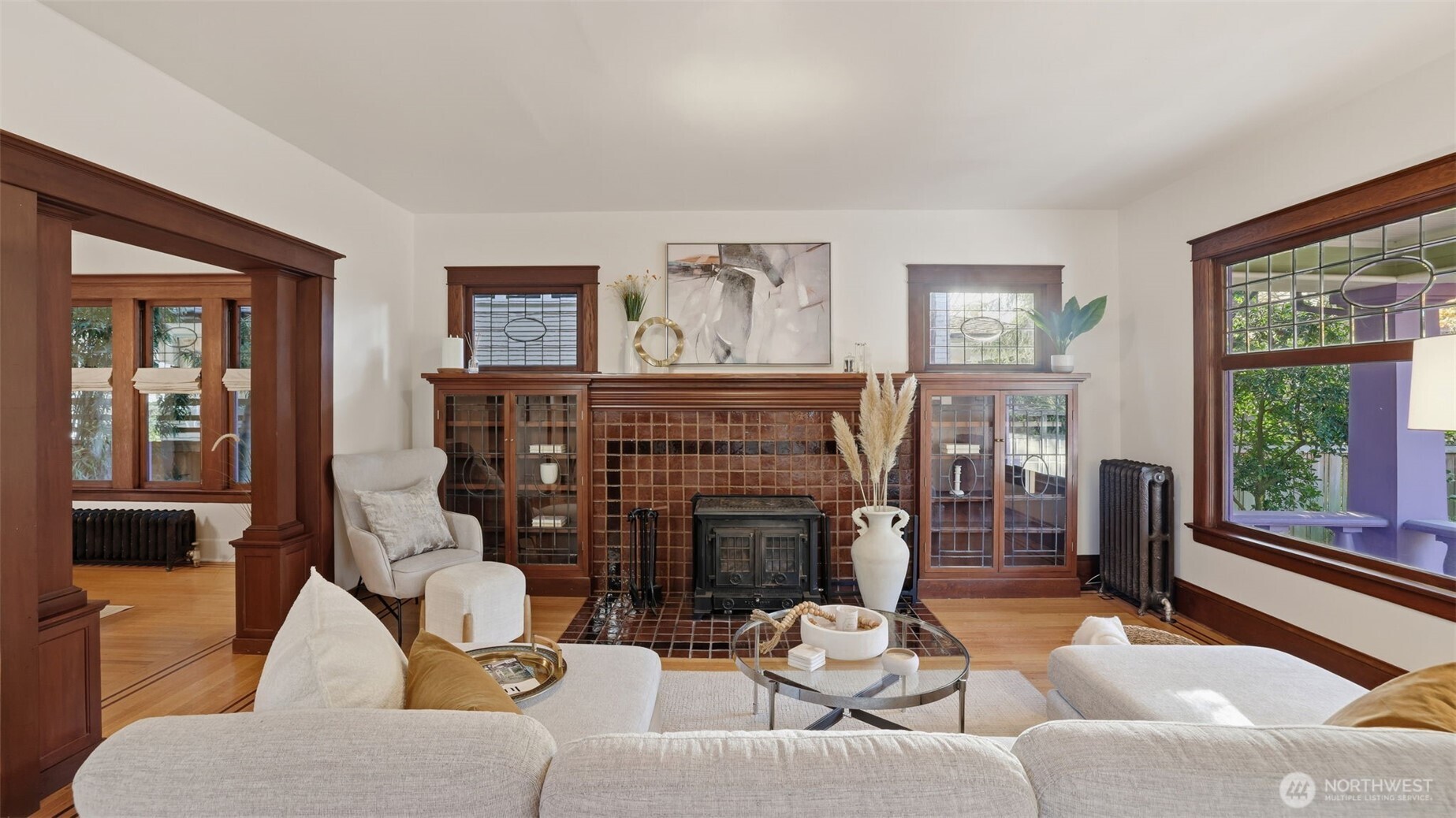 908 15th Avenue East Seattle, WA 98112 - Photo 7 of 37 a living room with fireplace furniture and a large window
