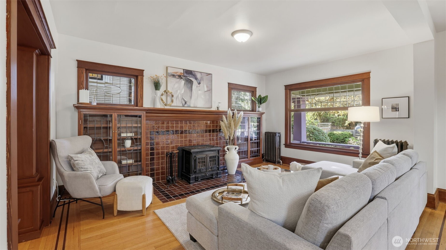 908 15th Avenue East Seattle, WA 98112 - Photo 8 of 37 a living room with furniture large window and fireplace